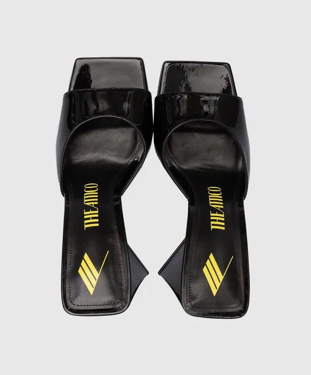 The Attico Devon mules in black patent leather with a figured heel