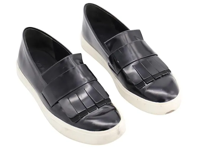 Vince Conventry Zapatillas Slip-On Kiltie con flecos en cuero negro 